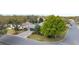 An aerial view shows a home with a mature trees and a well-maintained lawn at 8961 Se 130Th Loop, Summerfield, FL 34491