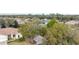 This is a front view of a home with a mature trees and a landscaped yard at 8961 Se 130Th Loop, Summerfield, FL 34491