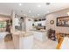 Bright kitchen with white cabinets, stainless appliances, granite countertops, and center island at 8961 Se 130Th Loop, Summerfield, FL 34491