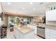 Spacious kitchen boasts granite countertops, stainless steel appliances, and access to the lanai at 8961 Se 130Th Loop, Summerfield, FL 34491