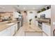 Modern kitchen features stainless steel appliances, granite countertops, and ample cabinet space at 8961 Se 130Th Loop, Summerfield, FL 34491