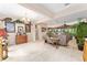 Spacious living room with tile floors, neutral paint, and an open layout to the Gathering room at 8961 Se 130Th Loop, Summerfield, FL 34491