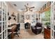 This is an office with built in bookshelves, and a ceiling fan at 8961 Se 130Th Loop, Summerfield, FL 34491