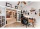 Open office featuring wood desk and decorative shelving at 8961 Se 130Th Loop, Summerfield, FL 34491