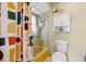 Bathroom featuring a shower, toilet, and a cabinet at 9305 Bahia Track Way, Ocala, FL 34472