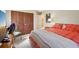 Bedroom with a view to a large closet, bed, and chair at 9305 Bahia Track Way, Ocala, FL 34472