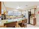 Functional kitchen with a stainless steel refrigerator, bright countertops and ample natural light at 9305 Bahia Track Way, Ocala, FL 34472