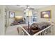 Inviting living area with a ceiling fan, comfortable seating, and access to an outdoor patio at 9305 Bahia Track Way, Ocala, FL 34472