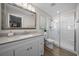 Bright bathroom featuring a glass shower, toilet, and vanity with cabinets at 9463 Sw 93Rd Loop, Ocala, FL 34481