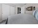 Comfortable bedroom with wood-look floors, slider closet, and stylish decor at 9463 Sw 93Rd Loop, Ocala, FL 34481
