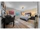 Well-lit bedroom featuring a queen-sized bed, desk, and modern ceiling fan at 9463 Sw 93Rd Loop, Ocala, FL 34481