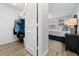 Bright bedroom showcases an open closet, wood flooring, and stylish decor at 9463 Sw 93Rd Loop, Ocala, FL 34481