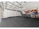 Spacious two car garage features rubber flooring and ample storage cabinets to stay organized at 9463 Sw 93Rd Loop, Ocala, FL 34481