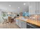 Bright kitchen with butcher block countertops, colorful backsplash, and modern appliances at 9463 Sw 93Rd Loop, Ocala, FL 34481