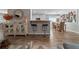 Open-concept living area with a kitchen bar, dining area, and modern decor at 9463 Sw 93Rd Loop, Ocala, FL 34481