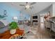 Cozy living room with blue walls, modern furniture, and an electric fireplace for a relaxing atmosphere at 9463 Sw 93Rd Loop, Ocala, FL 34481