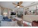 Cozy living room featuring a brick accent wall, stylish furnishings, and an open layout at 9463 Sw 93Rd Loop, Ocala, FL 34481