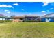 Expansive backyard with lush green grass and a screened lanai at 9841 Sw 95Th Loop, Ocala, FL 34481