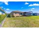 Well-maintained backyard with a spacious screened-in lanai at 9841 Sw 95Th Loop, Ocala, FL 34481