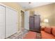 Comfortable bedroom featuring a cozy sofa, ottoman, ceiling fan, and natural light at 9841 Sw 95Th Loop, Ocala, FL 34481