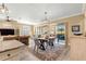 Bright dining area with stylish lighting, comfortable seating, and seamless transition to the living space at 9841 Sw 95Th Loop, Ocala, FL 34481