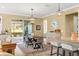 Open dining area featuring modern lighting, stylish furnishings, and seamless flow to the living area at 9841 Sw 95Th Loop, Ocala, FL 34481