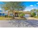 Charming single story home boasts a two car garage, manicured lawn and mature landscaping at 9841 Sw 95Th Loop, Ocala, FL 34481