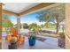 Relaxing front porch featuring comfortable seating, potted plants, and a view of the neighborhood at 9841 Sw 95Th Loop, Ocala, FL 34481