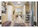 Bright hallway featuring wood floors, decorative accents, and seamless transitions to other living spaces at 9841 Sw 95Th Loop, Ocala, FL 34481