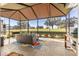 Relaxing screened-in lanai featuring comfortable seating and a beautiful view at 9841 Sw 95Th Loop, Ocala, FL 34481