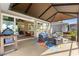 Inviting lanai with outdoor seating, a ceiling fan, and access to the home's interior at 9841 Sw 95Th Loop, Ocala, FL 34481