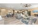 Open-concept living area with stylish furnishings, modern decor, and seamless flow to the dining area at 9841 Sw 95Th Loop, Ocala, FL 34481
