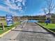 Community boat ramp with lake access, featuring well-maintained signs with lake rules and information at Tbd Malauka Rd, Ocklawaha, FL 32179