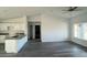 Bright, open-concept living room featuring wood floors and a modern kitchen, perfect for entertaining at Tbd Malauka Rd, Ocklawaha, FL 32179