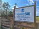 Sunnyhill sign offers a glimpse into the restoration area, framed by a rustic wooden fence at Tbd Malauka Rd, Ocklawaha, FL 32179