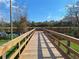 Wooden dock for fishing and recreation surrounded by trees at Tbd Malauka Rd, Ocklawaha, FL 32179