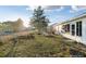 Spacious backyard featuring an enclosed sunroom and outdoor seating area at 10071 Sw 90Th Loop, Ocala, FL 34481