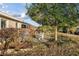 Secluded backyard offers a patio shaded by mature trees, perfect for relaxing and entertaining at 10071 Sw 90Th Loop, Ocala, FL 34481