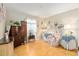 Spacious bedroom with wood floors and a large window at 10071 Sw 90Th Loop, Ocala, FL 34481