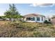 Exterior showing enclosed lanai and expansive yard space at 10071 Sw 90Th Loop, Ocala, FL 34481