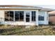 Exterior view of home showing the enclosed sun room at 10071 Sw 90Th Loop, Ocala, FL 34481