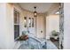 Inviting front porch with seating and a hanging light fixture for added ambiance at 10071 Sw 90Th Loop, Ocala, FL 34481