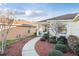 Well-maintained landscaping and a front porch create a warm, inviting welcome to the home at 10071 Sw 90Th Loop, Ocala, FL 34481