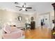Cozy living room with hardwood floors and glass coffee table at 10071 Sw 90Th Loop, Ocala, FL 34481