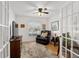 Living room featuring french doors and wood flooring at 10071 Sw 90Th Loop, Ocala, FL 34481
