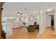 Bright living room features wood floors, ceiling fan and sliding glass doors at 10071 Sw 90Th Loop, Ocala, FL 34481