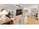 Open-concept living room with a television and breakfast bar at 10071 Sw 90Th Loop, Ocala, FL 34481