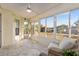 Enclosed sun room with tile flooring and an airy ambiance from surrounding windows at 10071 Sw 90Th Loop, Ocala, FL 34481