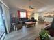 Comfortable living room adjacent to the kitchen and dining area, perfect for entertaining at 1118 Pelion Pl, The Villages, FL 32162