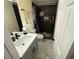 Modern bathroom featuring sleek vanity and black tiled shower at 1127 Enchanted Dr, Lakeland, FL 33801